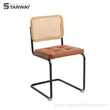 Modern rattan chair with soft cushion steel leg